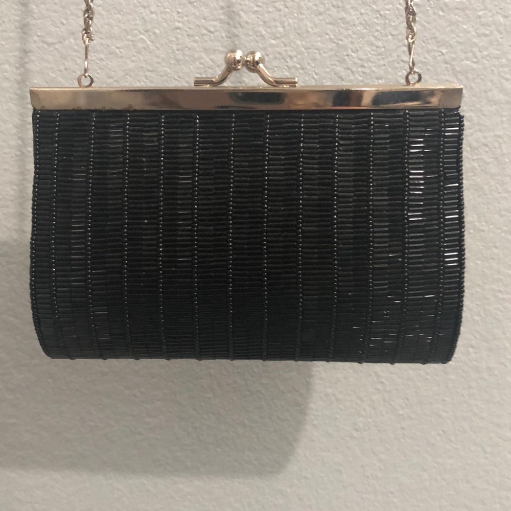 Beautiful black small purse with very long chain. Used once for special occasion